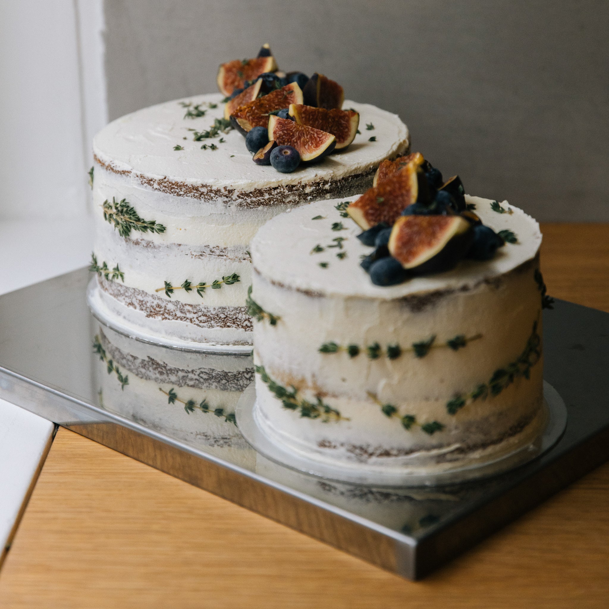 Naked cake constructed with 3 layers of vanilla cake with lemon & yuzu custard scented with thyme leaves, finished with a light yusu sugar frosting and toped with fresh seasonal fruits. 