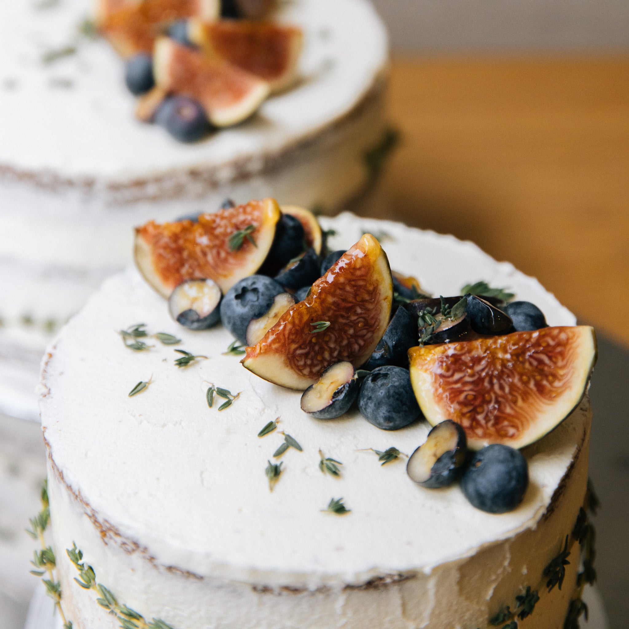 Naked cake constructed with 3 layers of vanilla cake with lemon & yuzu custard scented with thyme leaves, finished with a light yusu sugar frosting and toped with fresh seasonal fruits. 